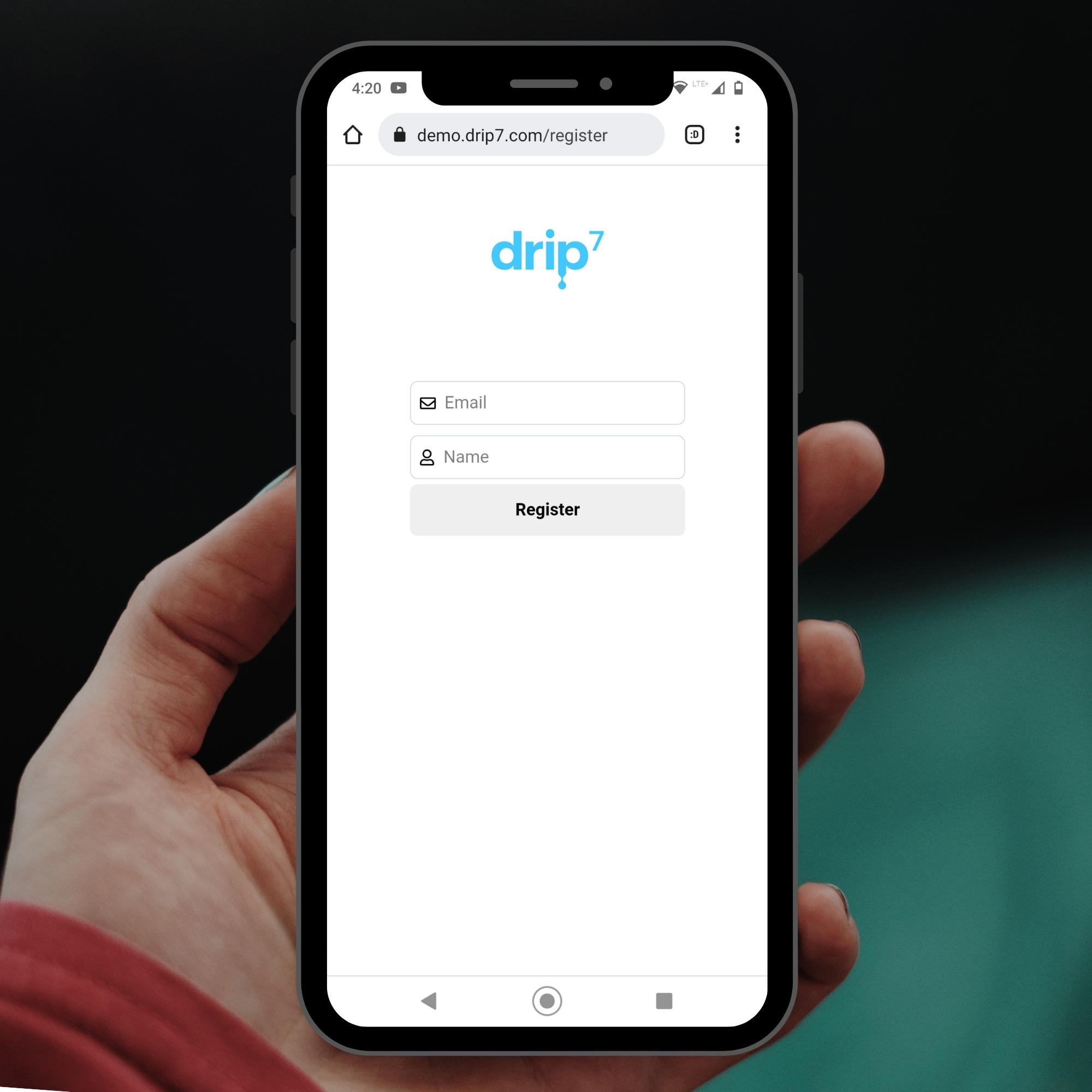 Drip7 Register screen on phone held by hand